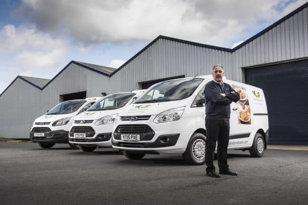 commercialvehicle.com_Mark Foster, Vanfridge Ltd, stands in front of three converted Transit Customs