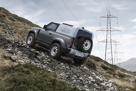 The Land Rover Defender Hard Top 2020 climbs a hill